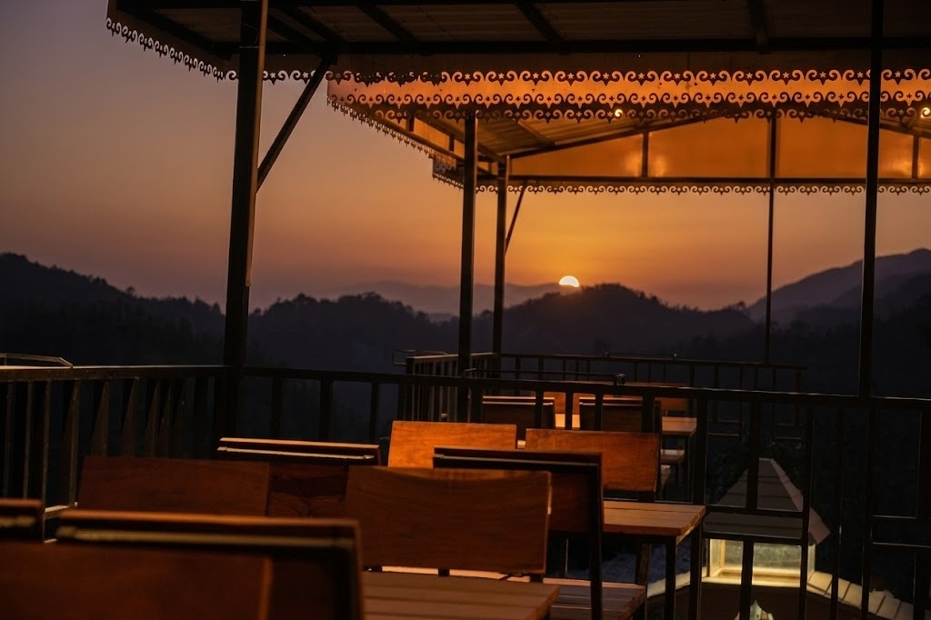 Sip your morning chai as golden sunlight bathes the peaks